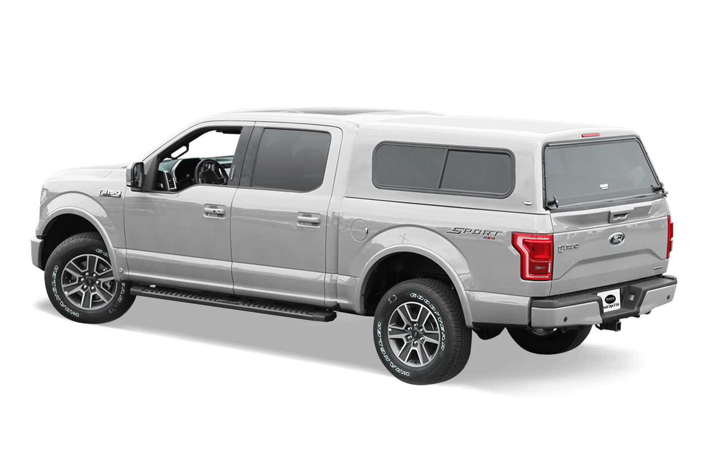 Silver Ford F-150 with Ranch Fiberglass Sierra Xtra Cab-high truck cap